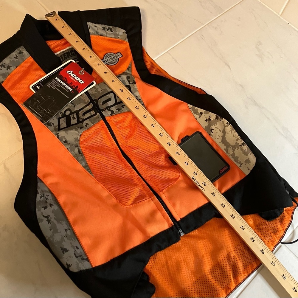 Icon motorcycle interceptor reflective vest. Orange / black / silver.